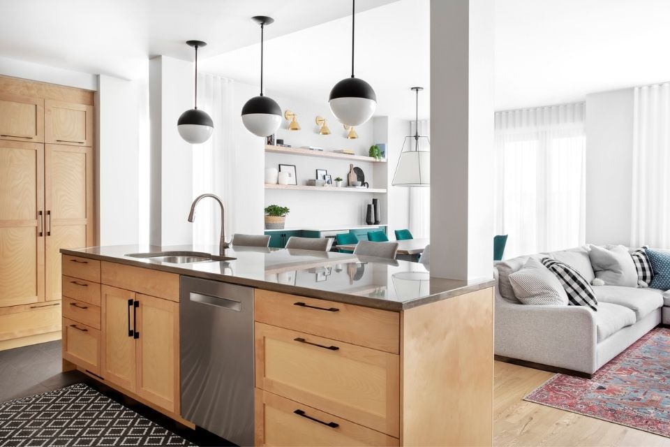 Wood and stone kitchen in natural space with lots of light